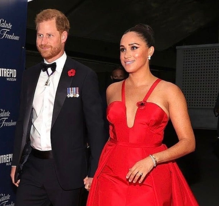 Meghan Markle Wears Carolina Herrera Red Evening Dress While Attending Intrepid Museum’s Salute to Freedom Gala With Prince Harry in New York
