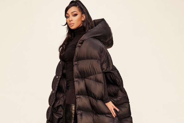 Monica Stuns in All Black Look Featuring Rick Owens Fall 2021 Floor-Length Hooded Puffer Vest, Wolford Turtleneck Top and Pants, and Balenciaga Leather Over-the-Knee Boots