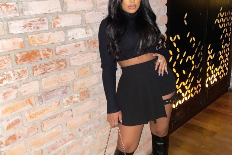 Taina Williams Steps Out in Black Look Featuring Fashion Nova Black Pleated Buckle Detail Skort