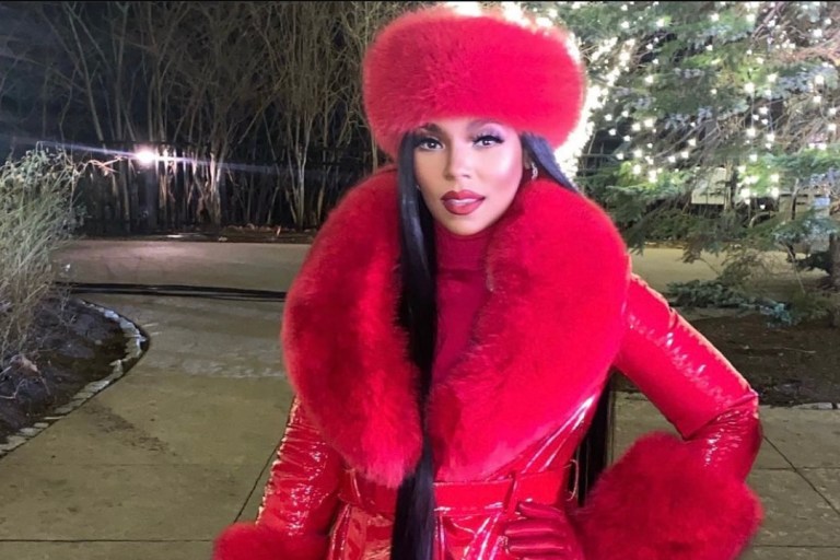 Ashanti Delivers Ultimate Holiday Glam for Performance at Foxwoods Resort Casino: Red Style Moment Featuring Custom Daniel’s Leather Faux Faur and Leather Coat and Hat Paired With Jennifer Le Black Croc Embossed Boots