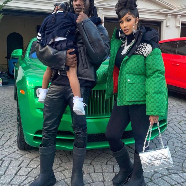 Cardi B and Offset Rock Matching Balenciaga x Crocs Black Boots While Attending Bulls and Hawks Game in Atlanta: Cardi B Pairs Her Boots with Gucci x North Face Green Black Logo Jacket