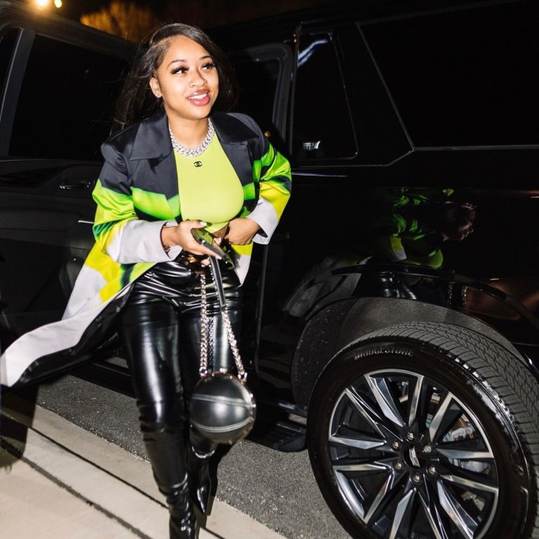 India Royale Steps Out in Neon Green and Black Look Featuring Fashion Nova Black Leather Pants
