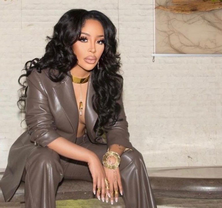 K. Michelle Wears Nanushka Brown Leather Suit With Voyetté Blue Satin Mules While Doing Press for Her New Lifetime Show ‘My Killer Body’
