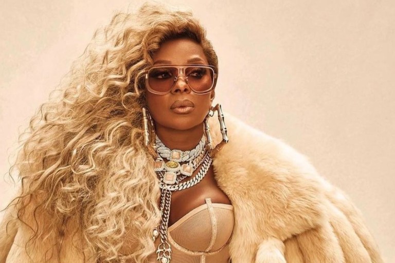 Mary J. Blige Stuns in Bottega Veneta Cream Shearling Padded Tails Coat and Roberto Cavalli Black Cutout Maxi Dress for ‘Amazing’ and ‘Good Morning Gorgeous’ Single Covers