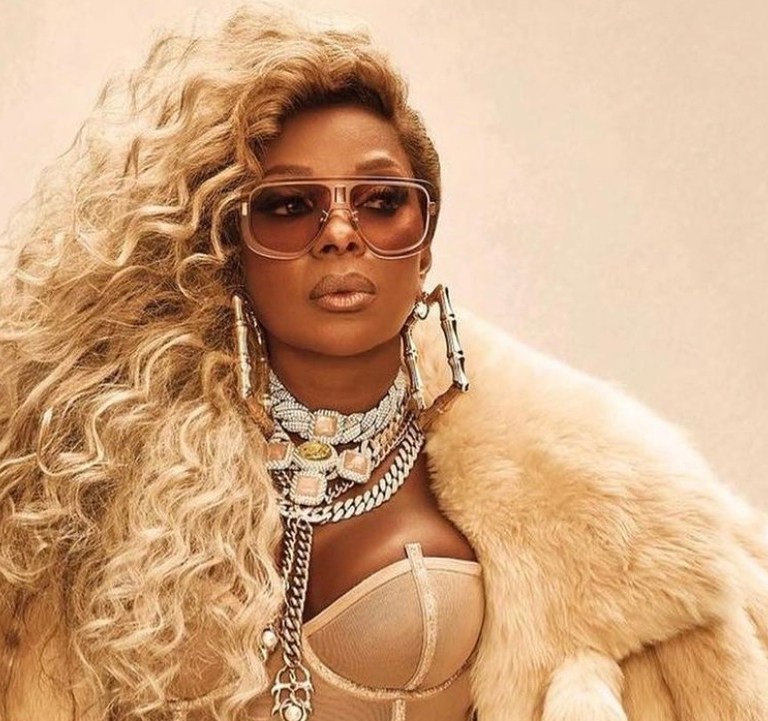 Mary J. Blige Stuns in Bottega Veneta Cream Shearling Padded Tails Coat and Roberto Cavalli Black Cutout Maxi Dress for ‘Amazing’ and ‘Good Morning Gorgeous’ Single Covers