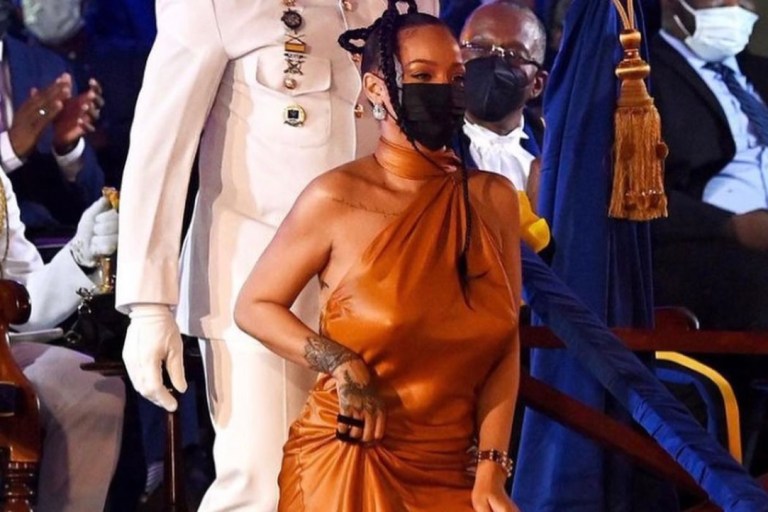 Rihanna Honored with National Hero Award in Barbados Wearing Bottega Veneta Fall 2021 Orange Silk Halter Dress