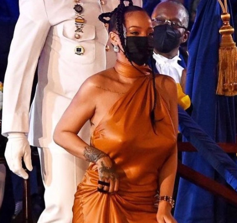 Rihanna Honored with National Hero Award in Barbados Wearing Bottega Veneta Fall 2021 Orange Silk Halter Dress