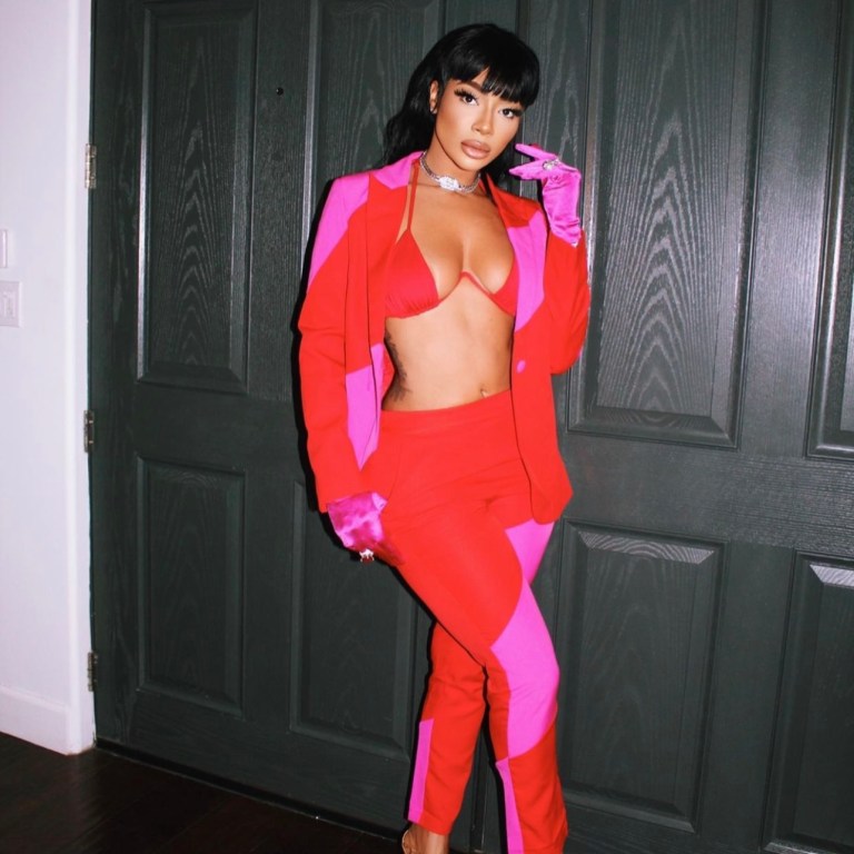Tommie Lee Spied in Red and Pink Striped Suit from Fashion Nova