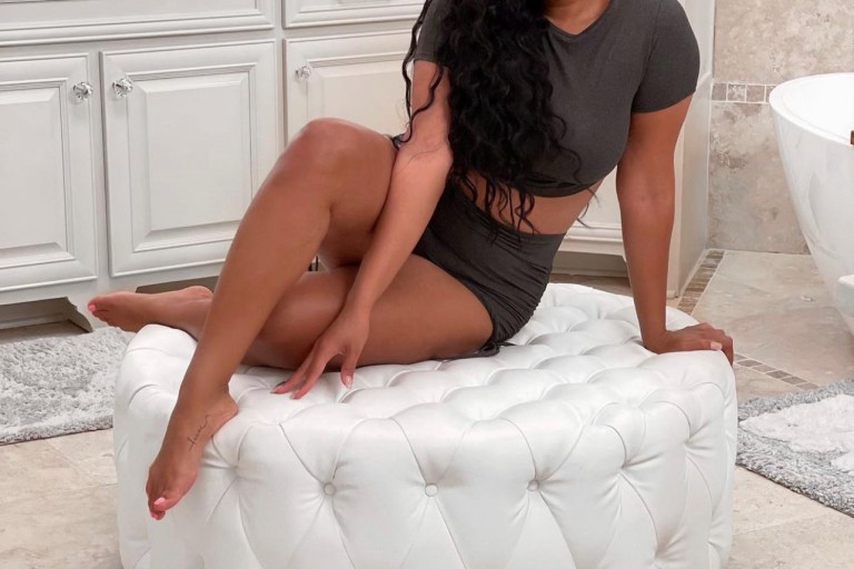 Angela Simmons Lounges in Fashion Nova Dark Grey Ruched Short Set