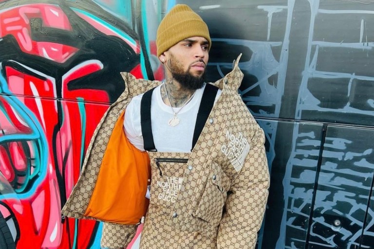 Chris Brown Spotted in Gucci x The North Face Monogram Jacket and Overalls Paired With Air Jordan 3 Sneakers