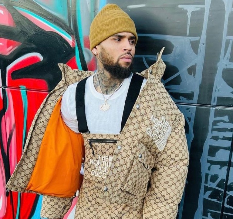 Chris Brown Spotted in Gucci x The North Face Monogram Jacket and Overalls Paired With Air Jordan 3 Sneakers