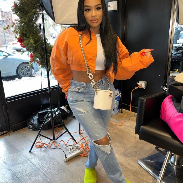 DreamDoll Spotted on Set Wearing Fashion Nova Orange Cropped Puffer Jacket