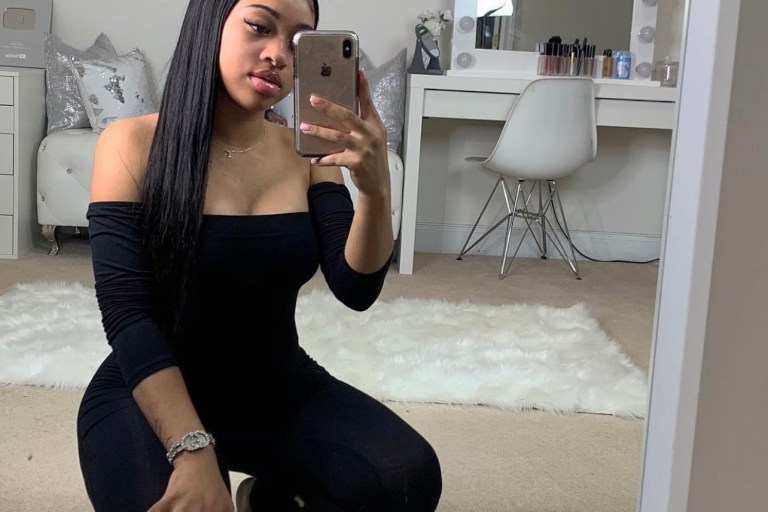 India Royale Spotted in Fashion Nova Black Off-The-Shoulder Jumpsuit