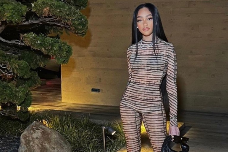 Jodie Woods Celebrates Her Birthday at Nobu Malibu Wearing KNWLS by Charlotte Knowles Beige Checked Top and Flared Pants Paired With Bottega Veneta Black Bag