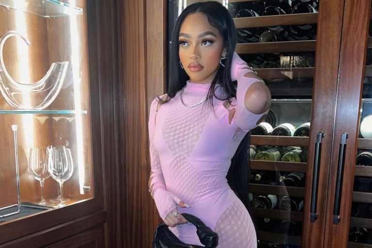 Jodie Woods Grabbed Dinner at Craig’s in LA Wearing Poster Girl Pink Polka Dot Lace Dress and Bottega Veneta Black Bag