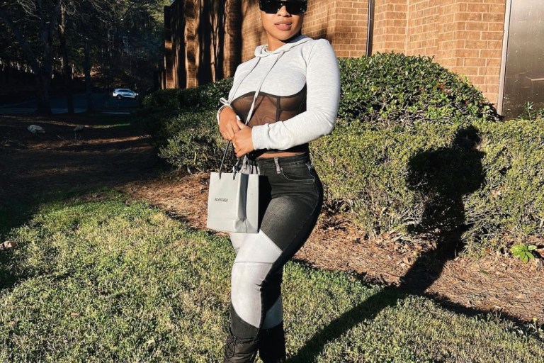 Reginae Carter Steps Out in Grey and Black Look Featuring Fashion Nova Patchwork Skinny Jeans