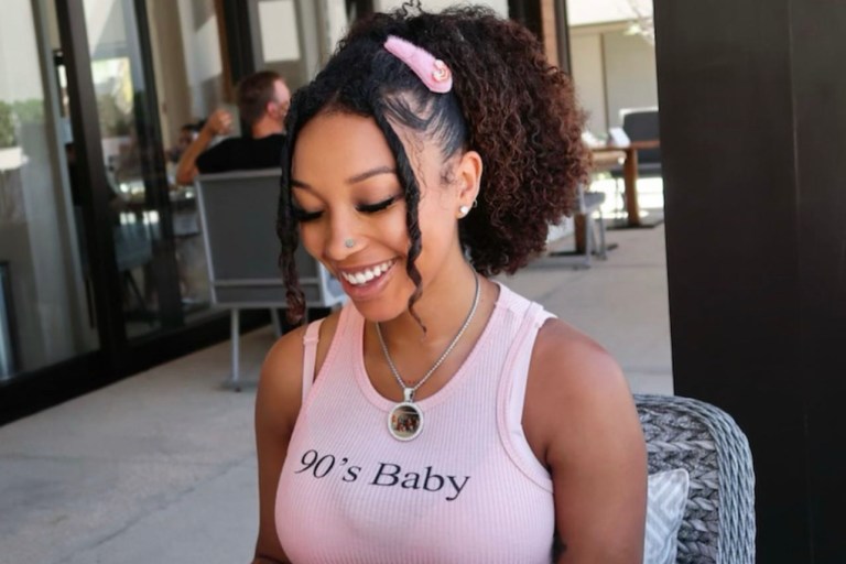 Zonnique Pullins Dines with Her Friends Wearing Pink ’90’s Baby’ Tank Top from Fashion Nova