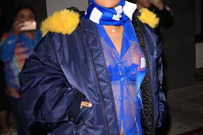 Rihanna Attends the Super Bowl in a $2,990 Navy Blue Balenciaga Day Yellow Fur Trimmed Jacket In Los Angeles
