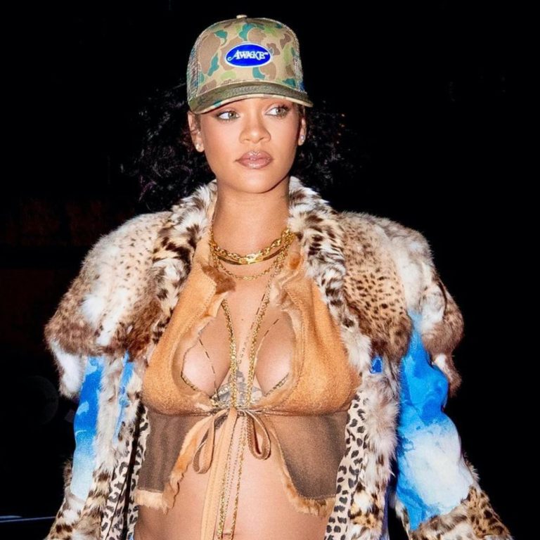 Rihanna Shows Off her Baby Bump Wearing a Vintage Blue Tie Dye Coat, Dior Bag, Tom Ford Snake Skin Sandals, and Awake Camouflage Trucker Hat