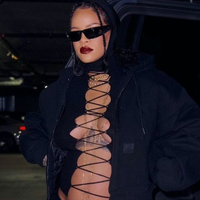Rihanna Shows Off Her Baby Bump in Balenciaga Wrap Sunglasses, Black Lace up Jean Paul Gaultier Top, Carhartt Jacket, and The Attico Jamie Stirrup Leggings