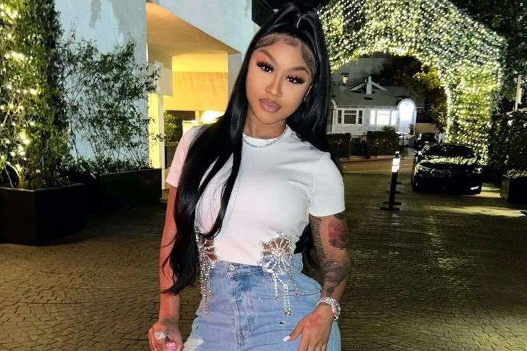 Ari Fletcher Shines Bright Like a Diamond in Area Crystal Top, Miu Miu Jeans, and Judith Leiber Champagne Bottle Bag