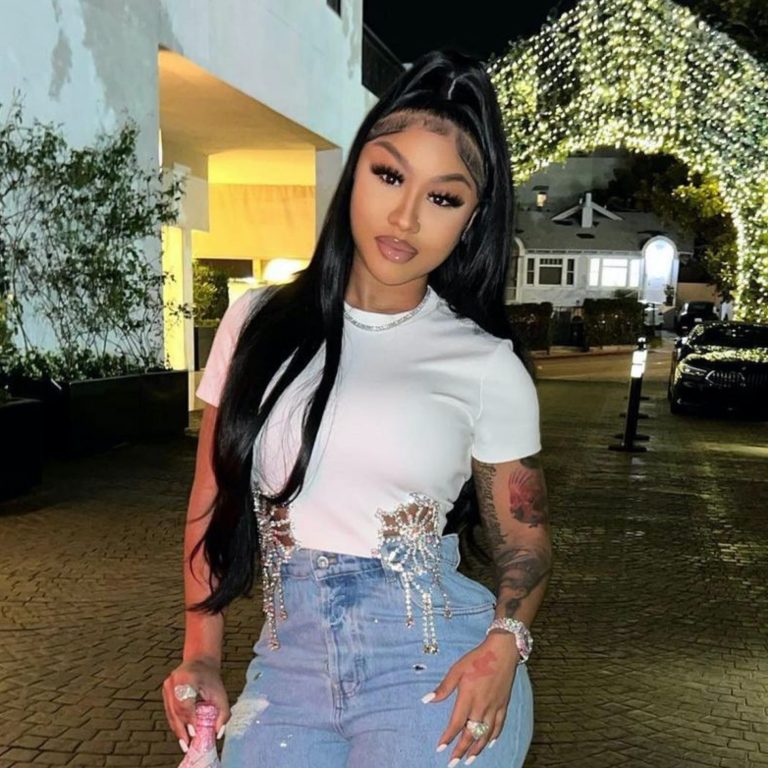 Ari Fletcher Shines Bright Like a Diamond in Area Crystal Top, Miu Miu Jeans, and Judith Leiber Champagne Bottle Bag