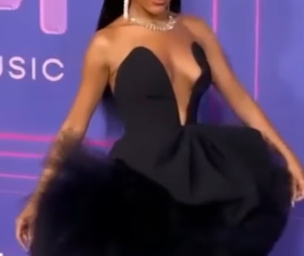 Doja Cat Attends The Billboard Women in Music 2022 event in a Black Carolina Herrera FW 22 Dress