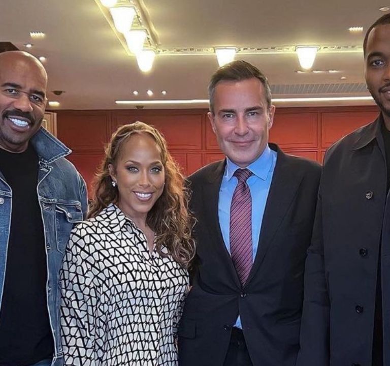 Steve Harvey Takes on Paris in a Custom Berluti Shearling coat, Tom Ford Denim Jacket and Fear of God Jeans with Wife Marjorie Harvey in a Valentino Shirt Dress