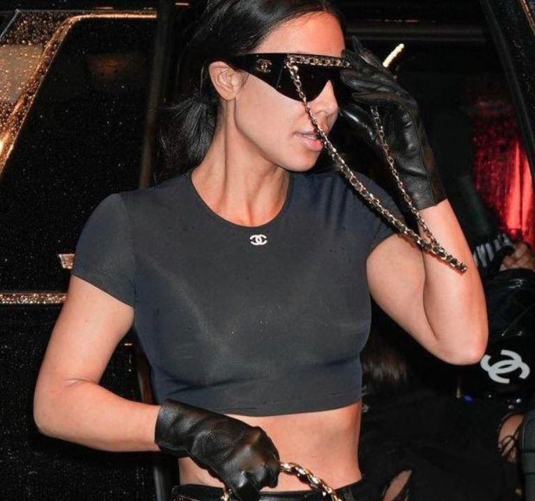 Kim Kardashian Wore a Black Chanel Crop Top,  Leather Pants and Quilted bag as she Arrived to New York for the MET Gala