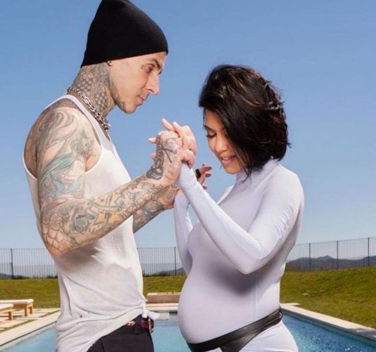 Fashion Bomb Couples: Kourtney Kardashian Posed in a Muted Blue Alaia Dress with Husband Travis Barker for their Gender Reveal Photoshoot