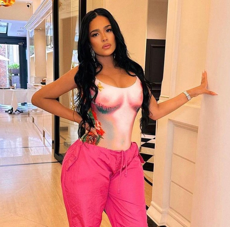 You Ask, We Answer: Stylist Emily B Posed in a Pink Jean Paul Gaultier One Piece and Shop Akira Pants