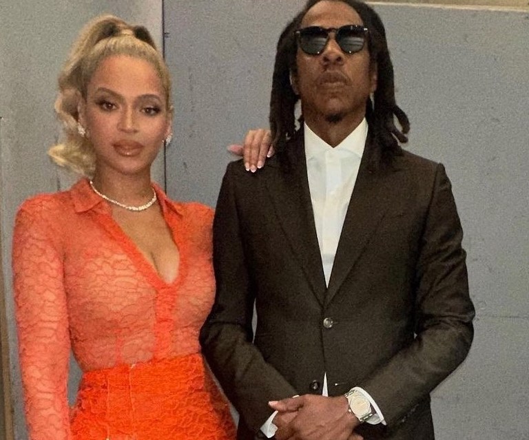 Beyonce Attends Jay Z’s Book of Hov Book Signing with Blue Ivy in Orange Laquan Smith Lace Top and Sequin Skirt + Blue Ivy’s Denim Reformation Dress and Fendi First Shield Sunglasses