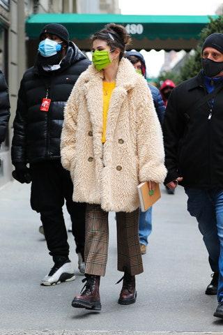 Image may contain Coat Clothing Apparel Human Person Footwear Shoe Overcoat Sweater and Helmet