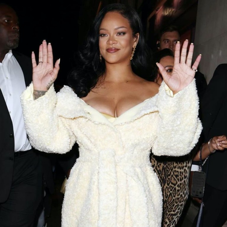 Rihanna Launches Fenty Hair in London in a Jacquemus Cream Coat, John Galliano SS 06 Ruffle Dress and Gold Custom Amina Muaddi Heels