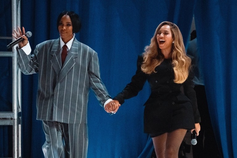 Beyonce and Kelly Rowland Campaign for Kamala Harris in Houston, with Beyonce in a Black Wardrobe NYC Blazer Dress and Kelly in a Fear of God Gray and White Striped Suit