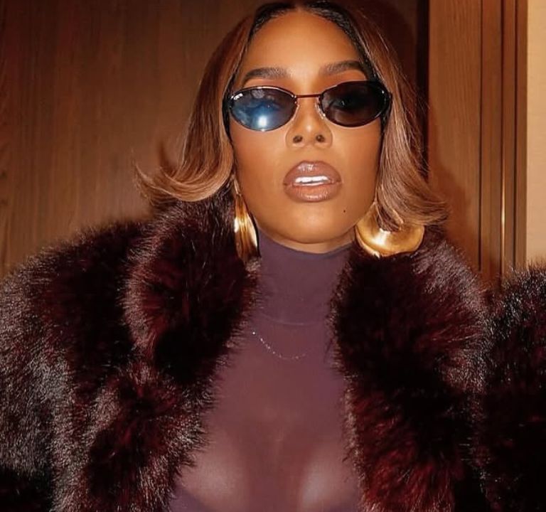 Kelly Rowland Wore a Burgundy ‘Sons of Gemini’ Dress and a $1,490 Retrofete Faux Fur Coat to Broadway