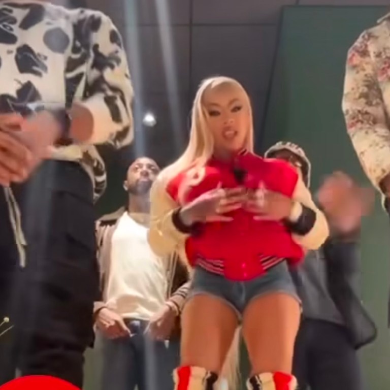 Keyshia Cole Danced to How do U Want it in a Red Celine Teddy Varsity Jacket and Bottega Veneta Red, Black, and White Striped Atomic Boots