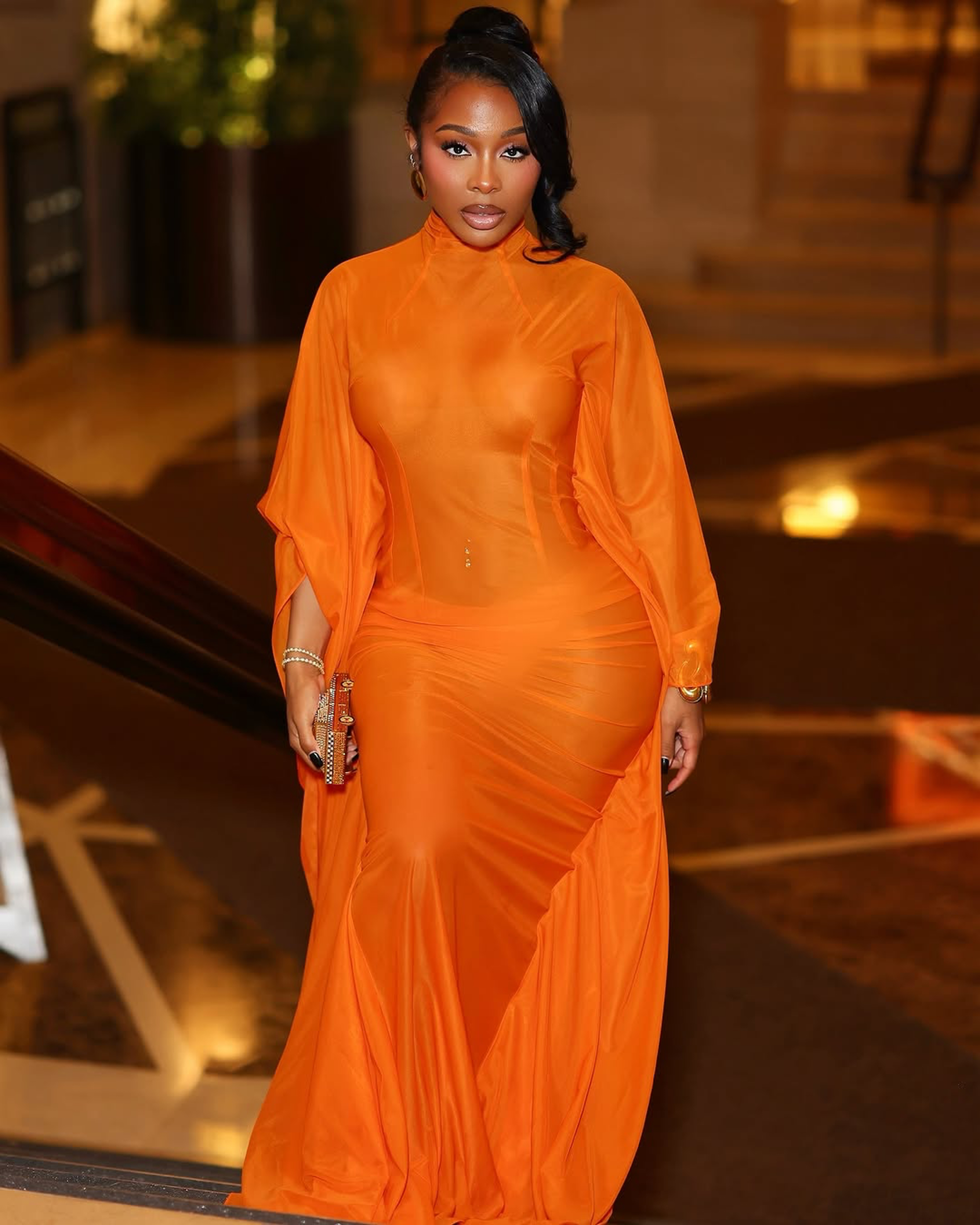 11 Jayda Cheaves Wears Laquan Smith Orange Gown And Brandon Blackwood Bomb Accessories To The Black Arts Council Benefit
