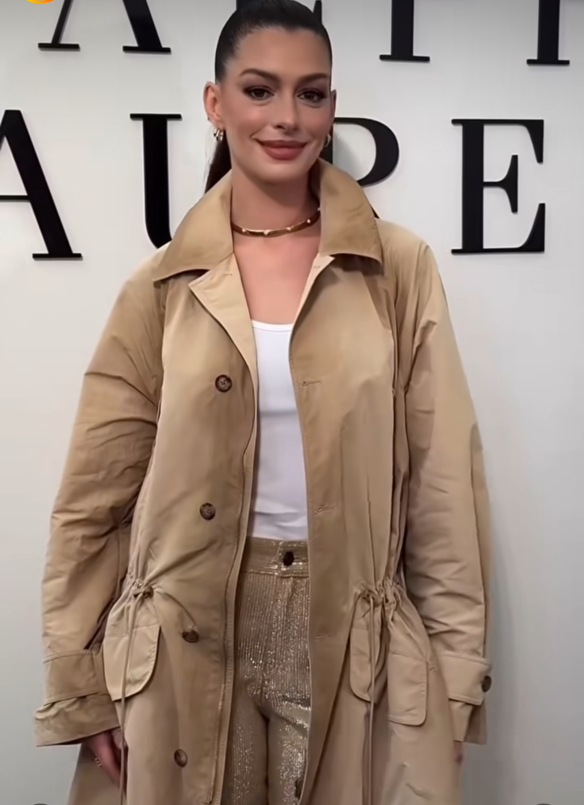 Anne Hathaway Attended The Ralph Lauren FW 25 Show In A Khaki Trench Coat And Sequins Embellished Jeans 3