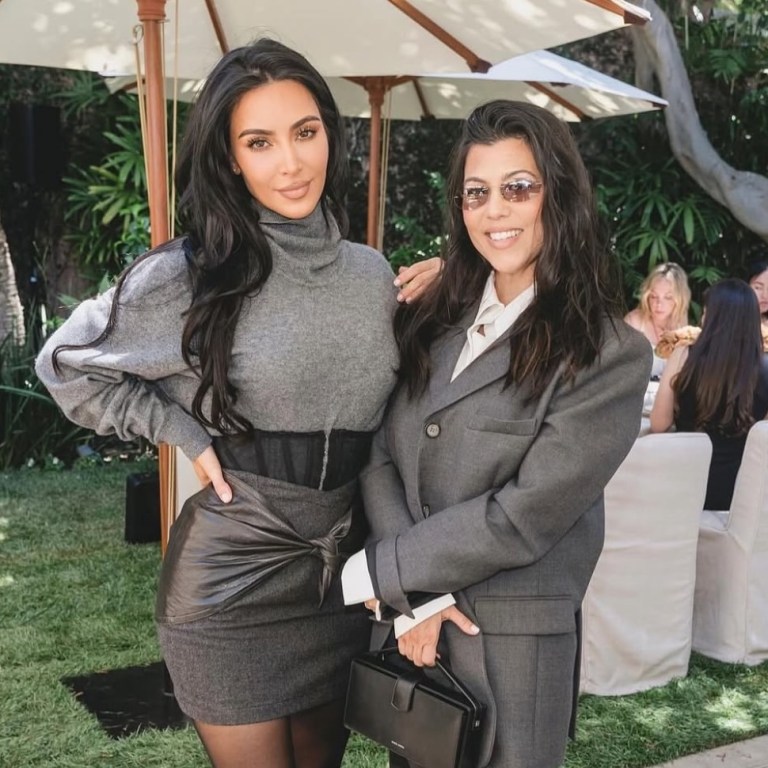 Kim Kardashian Celebrates Law School Graduation in Gray Sweater and a Black Vintage Versace Corseted Skirt