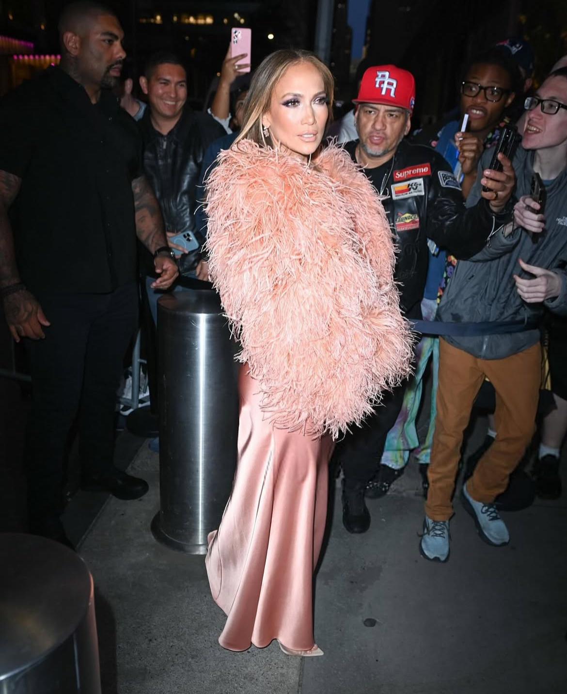 Jennifer Lopez Wore A Peach 835 22The New Arrival22 Dress With A Feather Bolero To The Ring Them Bells Benefit Concert In New York 1