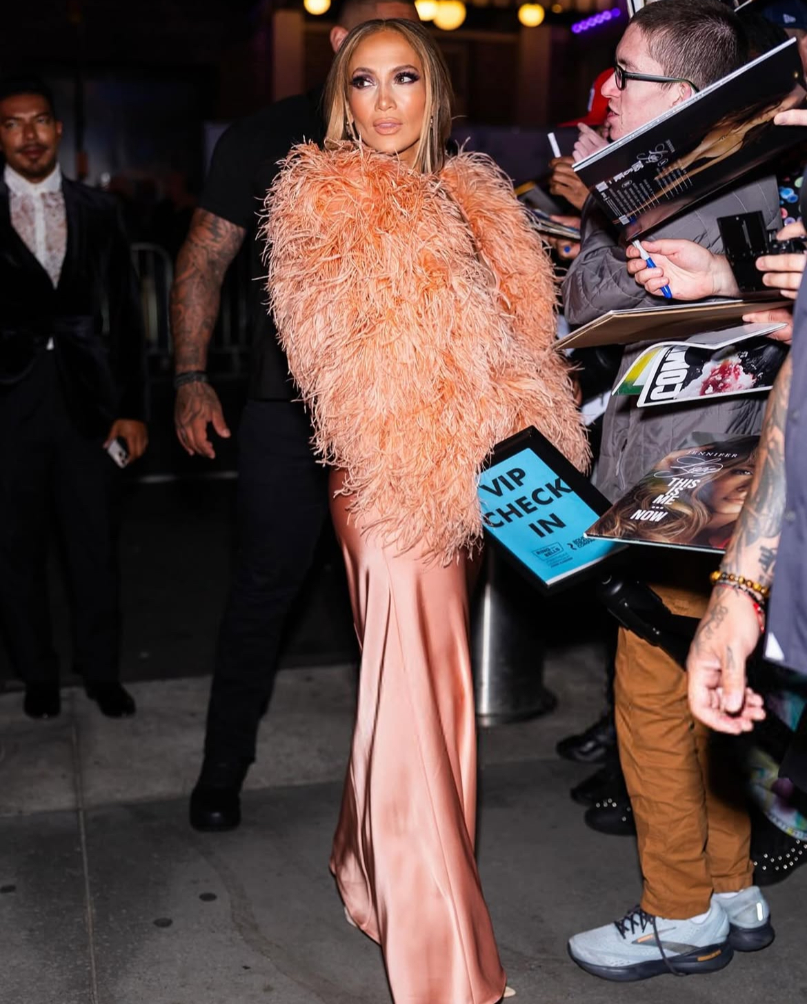 Jennifer Lopez Wore A Peach 835 22The New Arrival22 Dress With A Feather Bolero To The Ring Them Bells Benefit Concert In New York 2
