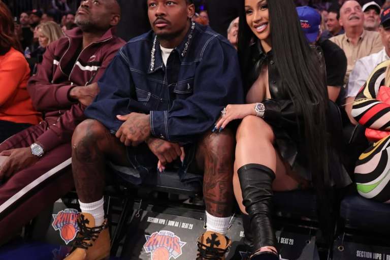 New Fashion Bomb Couple Cardi B and Stefon Diggs Sit Courtside with Cardi in a Leather Miu Miu Shirt and Skirt Set and Stefon in Simone Rocha Embellished Denim
