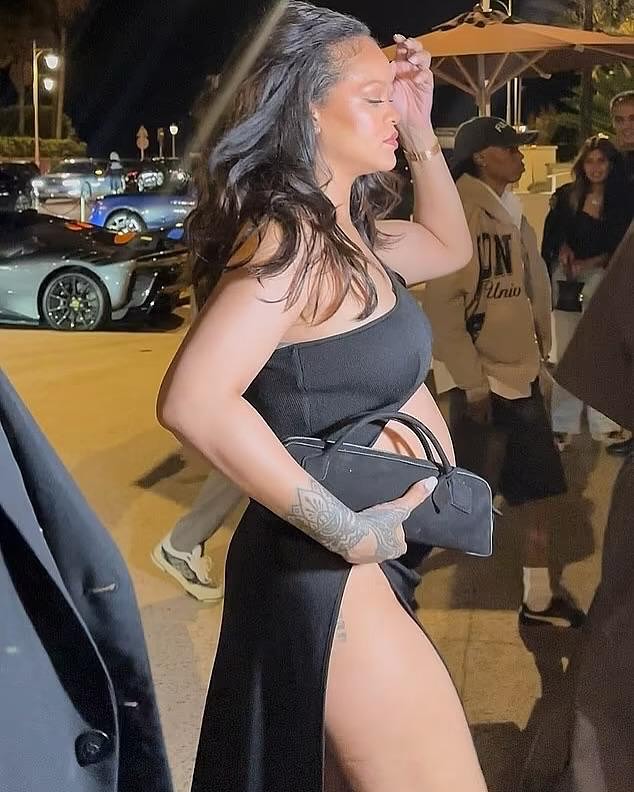 Rihanna Steps In A Black Cutout Alaia Maxi Dress With Beau AAP Rocky In A Brown Saint Laurent Trench Jacket In Cannes France 4