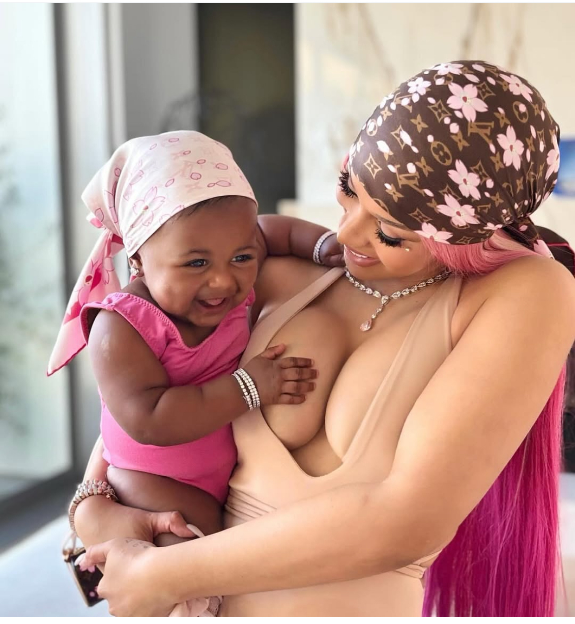 Cardi B Debuts Daughter Blossom In A Pink And Brown Louis Vuitton X Akashi Murakami Cherry Blossom Accessories 1