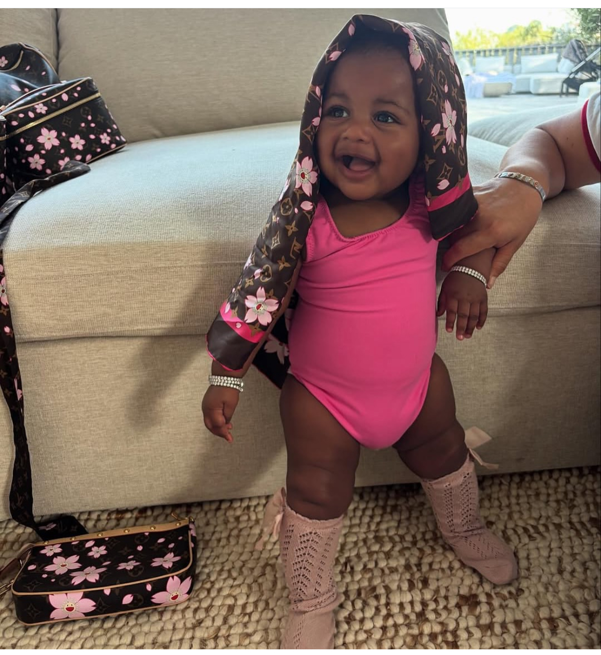 Cardi B Debuts Daughter Blossom In A Pink And Brown Louis Vuitton X Akashi Murakami Cherry Blossom Accessories 2