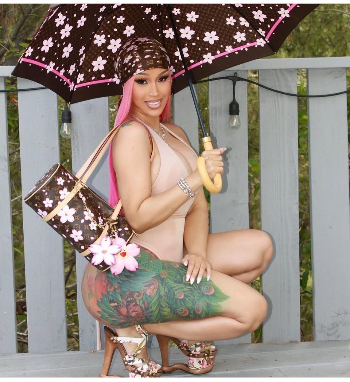 Cardi B Debuts Daughter Blossom In A Pink And Brown Louis Vuitton X Akashi Murakami Cherry Blossom Accessories 8