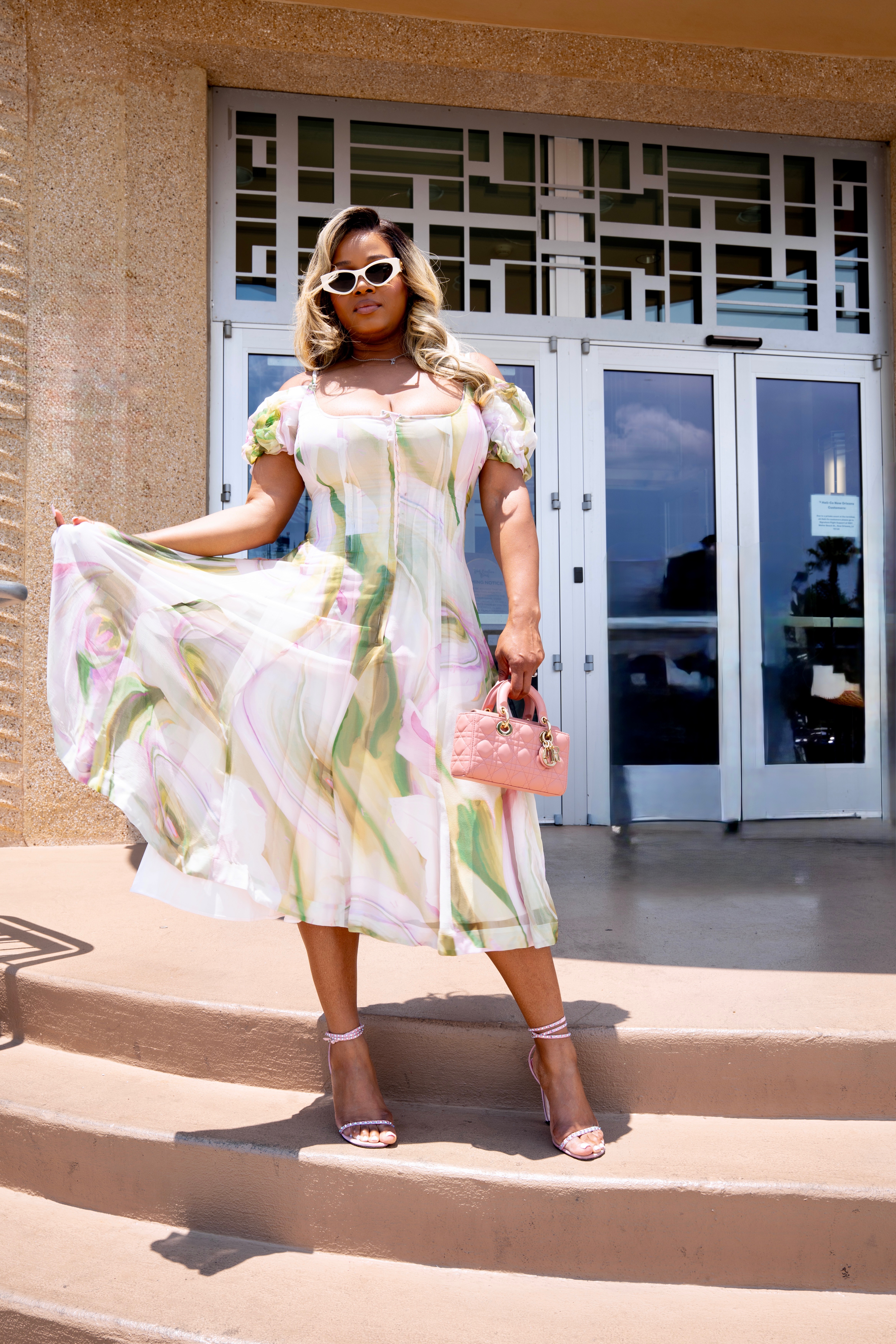 Fashion Bomb CEO Claire Sulmers Stuns In A White Floral Spero Sur Mer Dress During Essence Fest 5 1