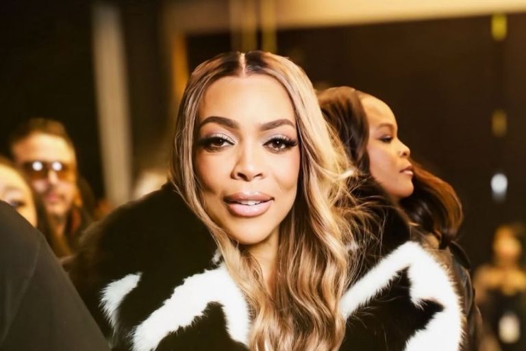 Wendy Williams Spotted at LaQuan Smith NYFW Show win a Black and White Fur Coat with Black Mini Shorts and a Snakeskin Hermes Bag