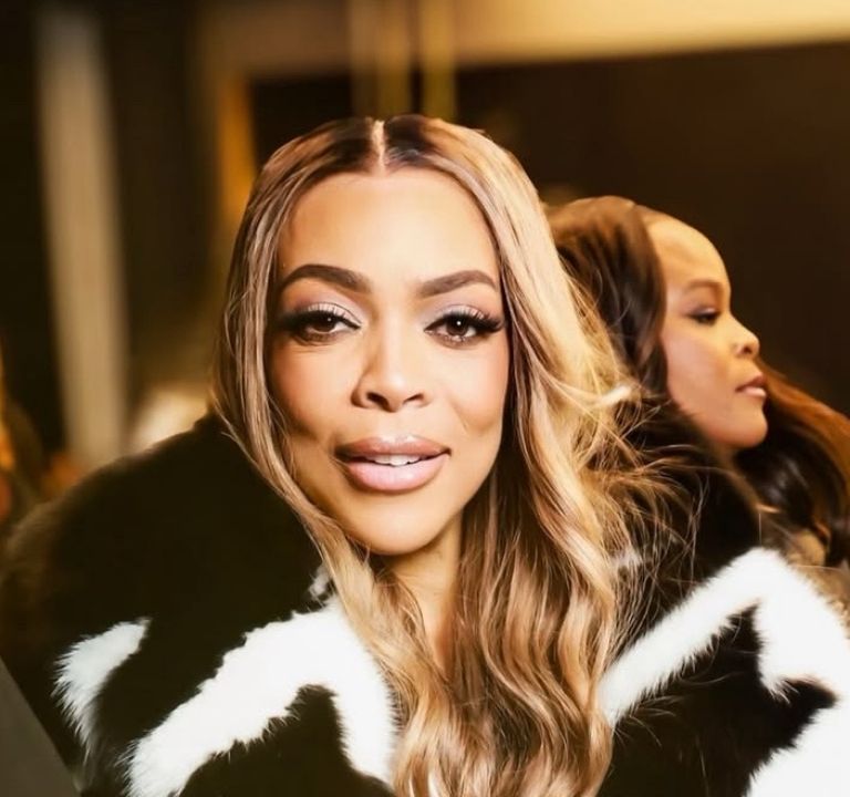 Wendy Williams Spotted at LaQuan Smith NYFW Show win a Black and White Fur Coat with Black Mini Shorts and a Snakeskin Hermes Bag